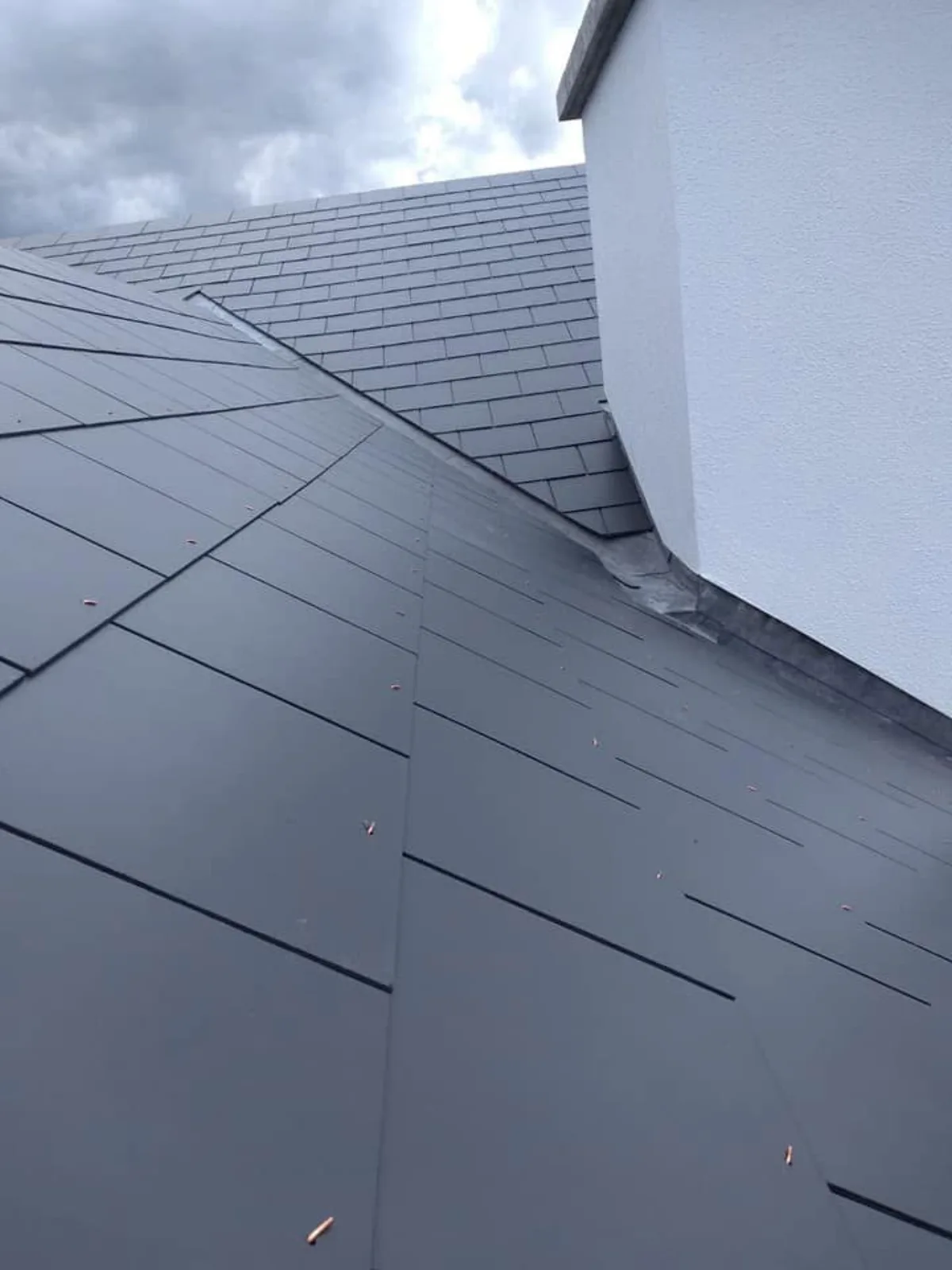 Repointed chimney stack with new code-graded lead step flashing on a Victorian terrace in Chelmsford