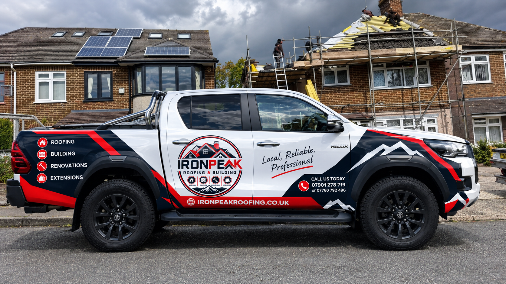 Iron Peak Roofing & Building branded pickup truck parked outside a re-roofing job in Essex