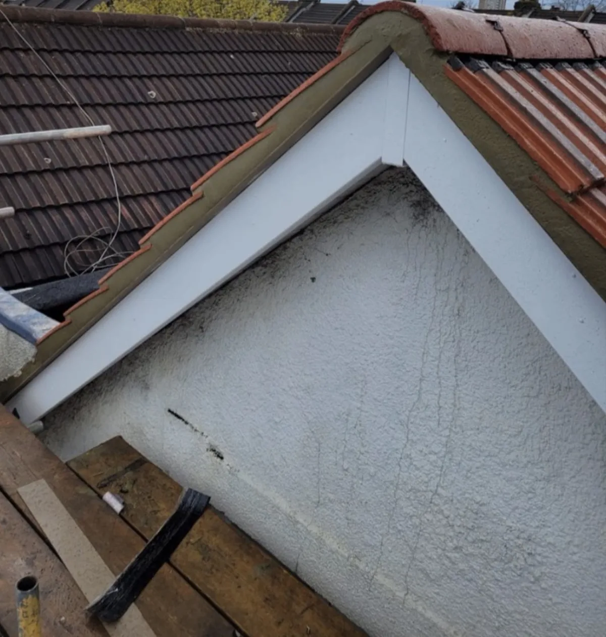 New white UPVC fascias, soffits and black guttering fitted to a semi-detached house in Halstead, Essex